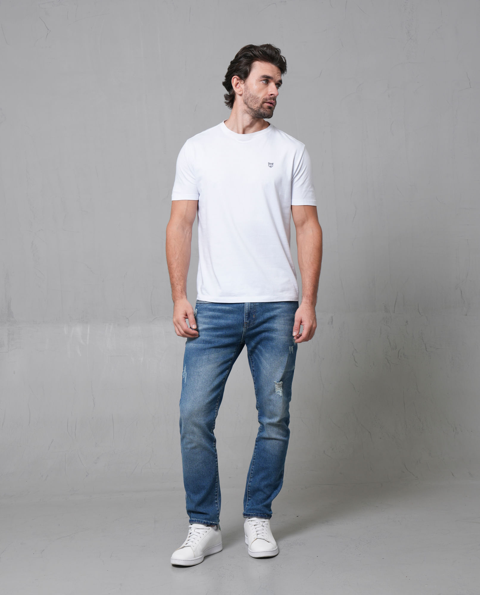 Jean Slim cinco bolsillos tono medio para hombre