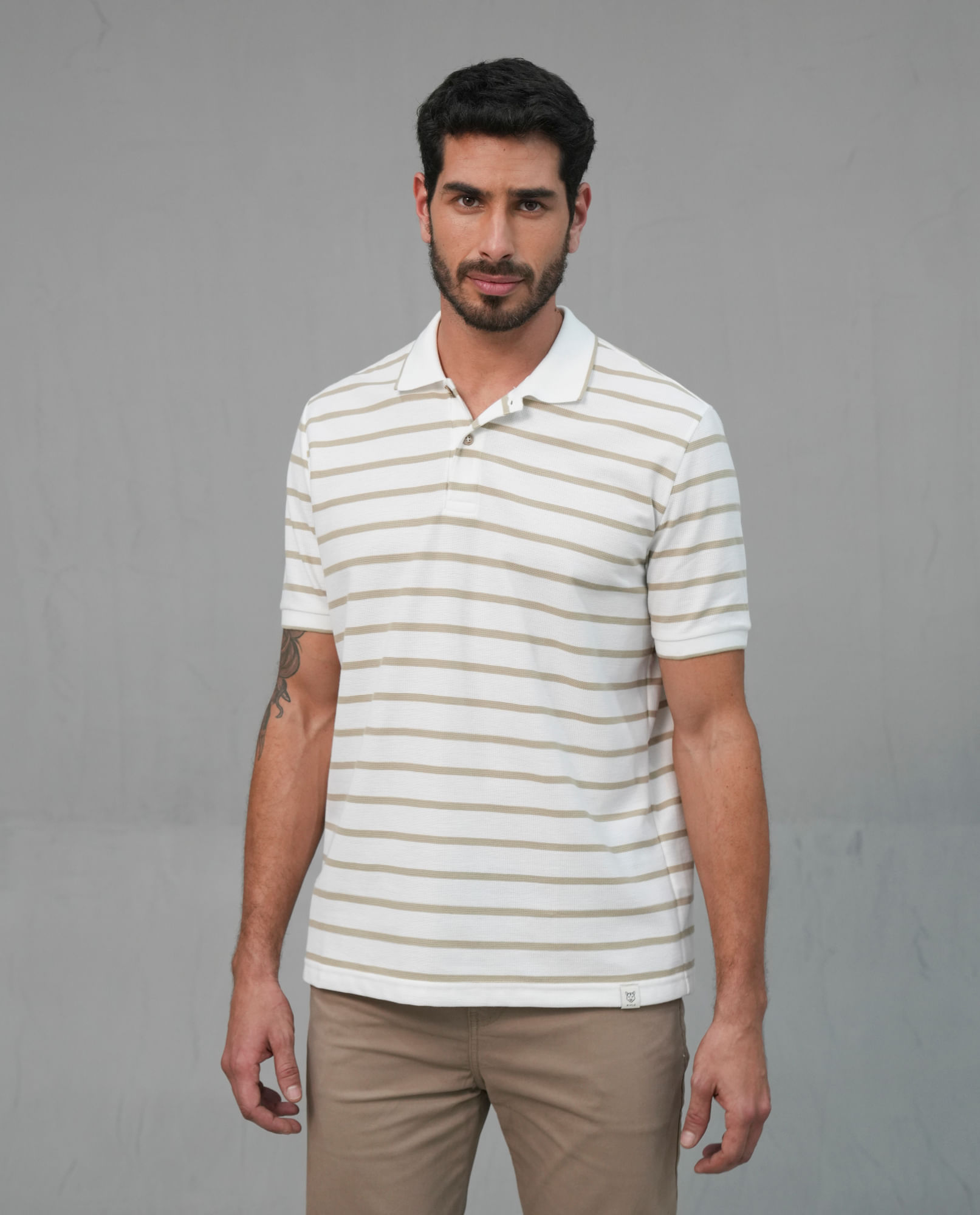 Polo a rayas horizontales con puños tejidos para hombre