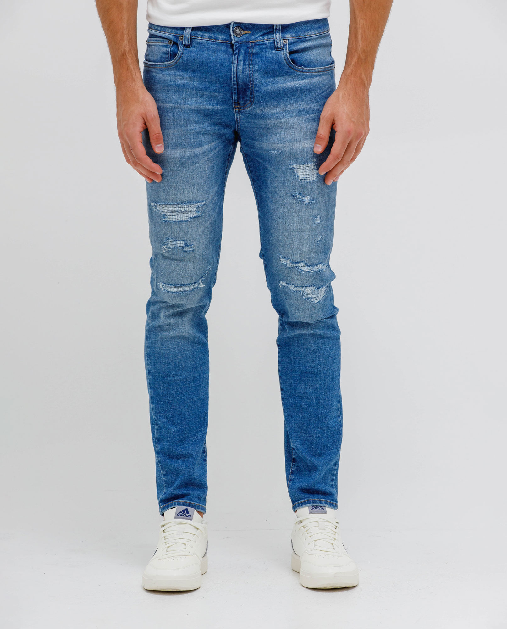 Jean Super Slim con desgastes localizados para hombre